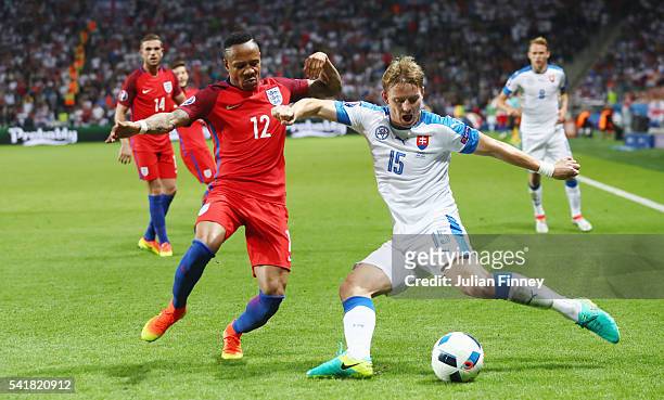 Tomas Hubocan of Slovakia and Nathaniel Clyne of England compete for the ball during the UEFA EURO 2016 Group B match between Slovakia and England at...