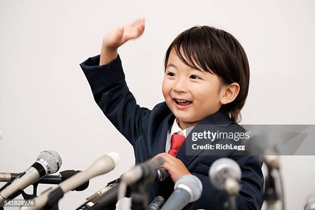 little boy japanese businessman - japan press conference stock pictures, royalty-free photos & images