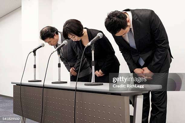 japanese business apology - japan press conference stock pictures, royalty-free photos & images