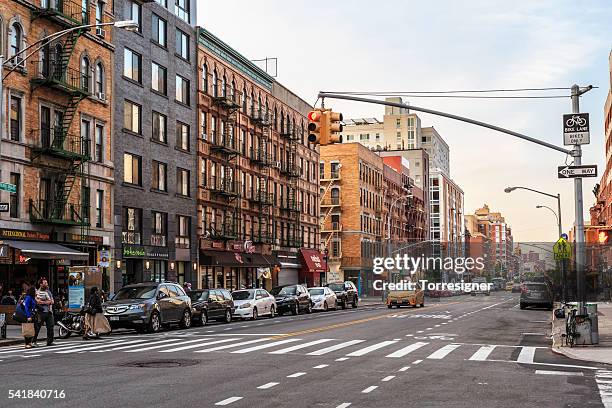 frederick douglass boulevard in harlem, at sunset - harlem new york stock pictures, royalty-free photos & images