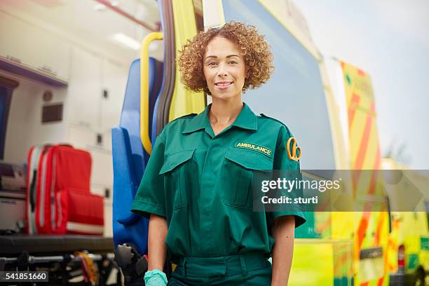 female paramedic portrait - ambulance uk stock pictures, royalty-free photos & images