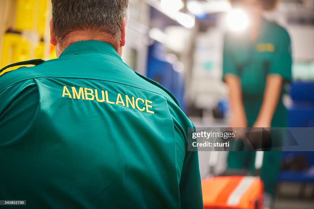 Ambulance crew pulling stretcher