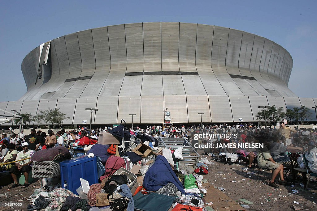 Hurricane Katrina Survivors Wait Outside