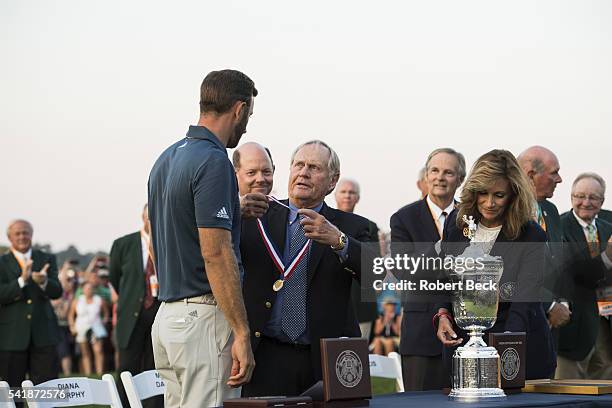 Dustin Johnson victorious, celebrates with Jack Nicklaus during trophy during presentation ceremony after winning tournament on Sunday at Oakmont CC....