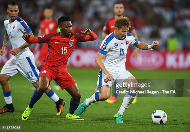 Daniel Sturridge of England compete for the ball during the UEFA EURO 2016 Group B match between Slovakia and England at Stade Geoffroy-Guichard on...