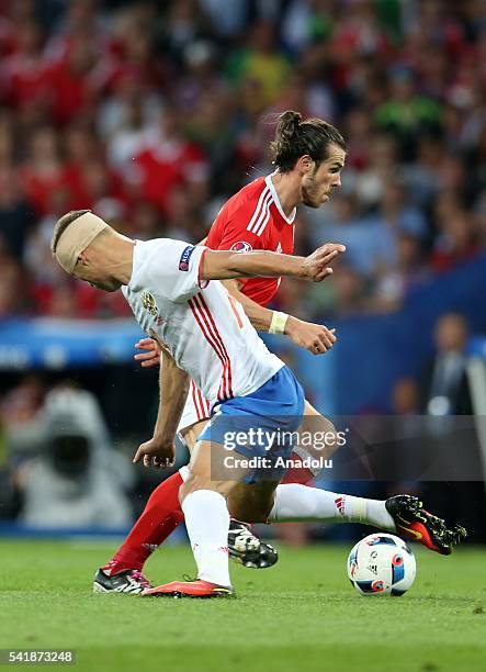 Vasili Berezutski of Russia in action against Gareth Bale of Wales during the UEFA EURO 2016 Group B match between Russia and Wales at Stadium...