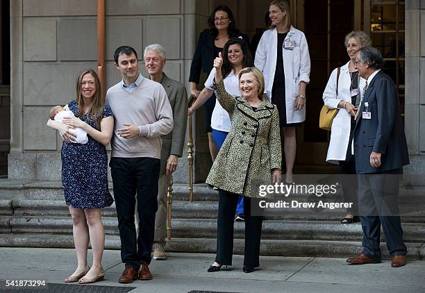 Chelsea Clinton, holding her newborn son Aidan, Marc Mezvinsky, former President Bill Clinton, and Democratic Presidential candidate Hillary Clinton...