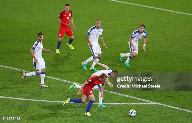 Harry Kane of England and Jan Durica of Slovakia compete for the ball during the UEFA EURO 2016 Group B match between Slovakia and England at Stade...