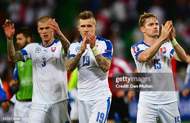 Martin Skrtel, Juraj Kucka and Tomas Hubocan of Slovakia applaud the supporters after their scoreless draw in the UEFA EURO 2016 Group B match...