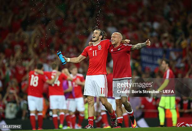 Gareth Bale and David Cotterill of Wales celebrate their team's 3-0 win in the UEFA EURO 2016 Group B match between Russia and Wales at Stadium...