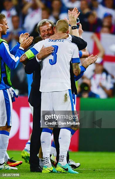 Manager Jan Kozak congratulates Martin Skrtel after their scoreless draw in the UEFA EURO 2016 Group B match between Slovakia and England at Stade...