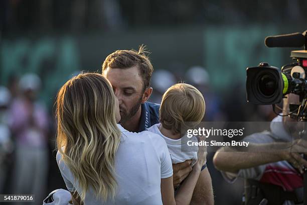 Dustin Johnson victorious with son Tatum and wife Paulina Gretzky during presentation ceremony after winning tournament on Sunday at Oakmont CC....