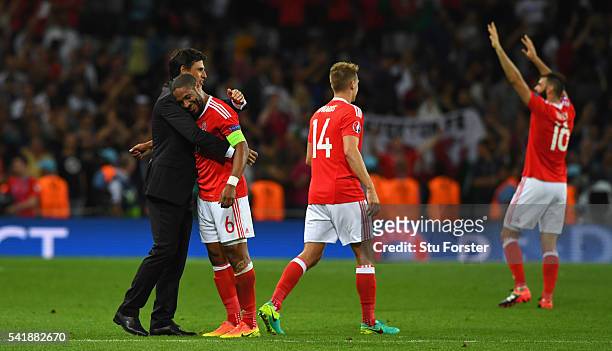 Wales manager Chris Coleman congratulates player Ashley Williams after the UEFA EURO 2016 Group B match between Russia and Wales at Stadium Municipal...