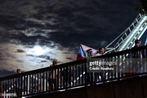 Fans walk under fullmoon light after the UEFA EURO 2016 Group B match between Russia and Wales at Stadium Municipal in Toulouse, France on June 20,...