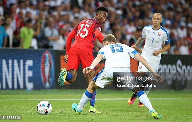 Daniel Sturridge of England and Tomas Hubocan of Slovakia in action during the UEFA EURO 2016 Group B match between Slovakia and England at Stade...