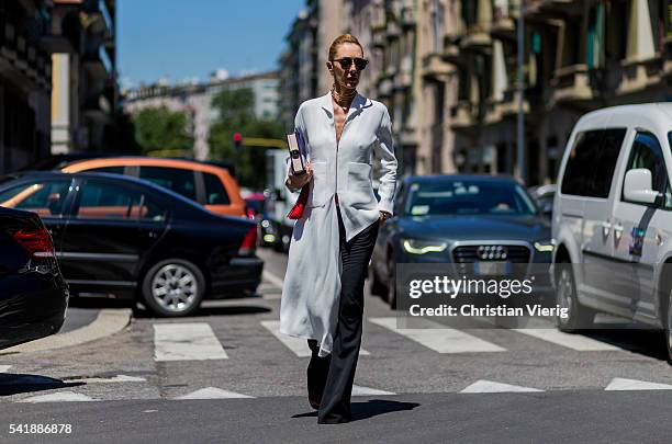 Elina Halimi outside Etro during the Milan Men's Fashion Week Spring/Summer 2017 on June 20, 2016 in Milan, Italy.