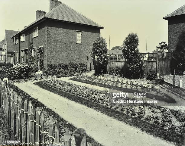 Garden at 187 Valence Wood Road, Becontree Estate, Ilford, London, 1929. Side elevation showing a garden which has been entered in a competition. A...