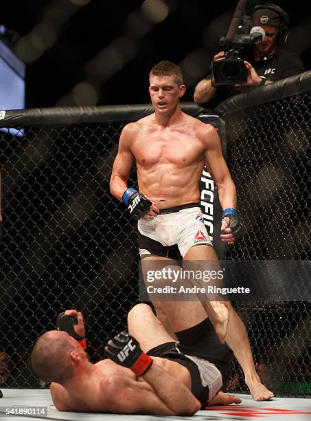 Stephen Thompson knocks down Rory MacDonald in their welterweight bout during the UFC Fight Night event inside the TD Place Arena on June 18, 2016 in...