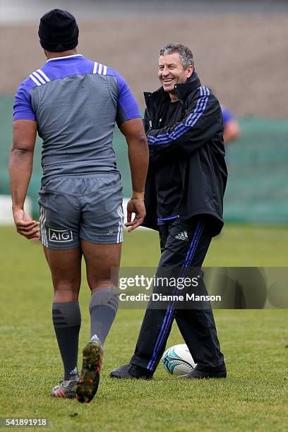 Wayne Smith, defence assistant coach of the All Blacks, speaks with Julian Savea during a New Zealand All Blacks training session on June 21, 2016 in...