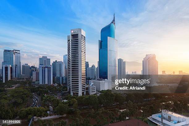 jakarta business district with iconic bni building - yakarta fotografías e imágenes de stock