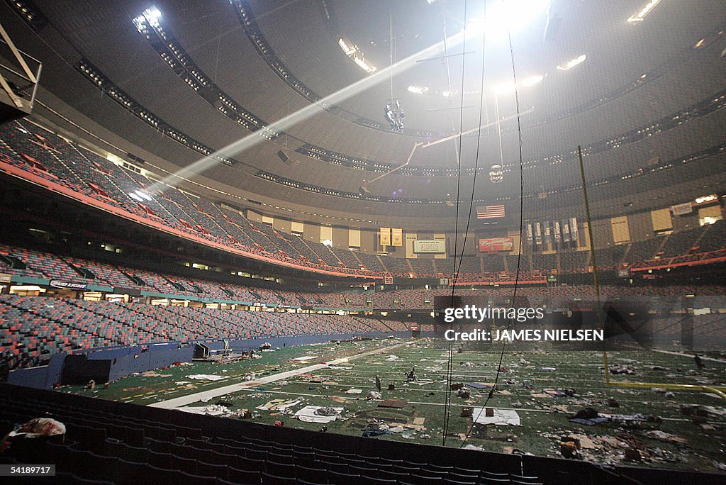 Trash litters the field at the Superdome