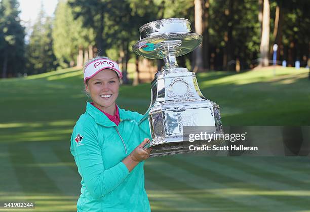 Brooke Henderson of Canada poses with the trophy after winning the KPMG Women's PGA Championship at the Sahalee Country Club on June 12, 2016 in...