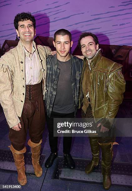 John Ciriani, Nick Jonas and Rob McClure pose backstage at the hit musical "Something Rotten!" on Broadway at The St.James Theatre on June 20, 2016...