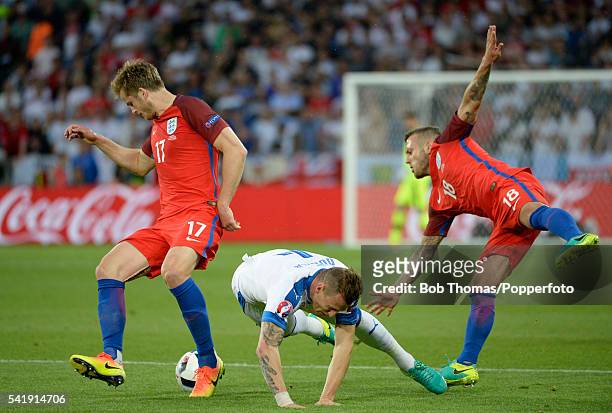 Jan Durica of Slovakia is tackled by Eric Dier and Jack Wilshere of England during the UEFA EURO 2016 Group B match between Slovakia and England at...