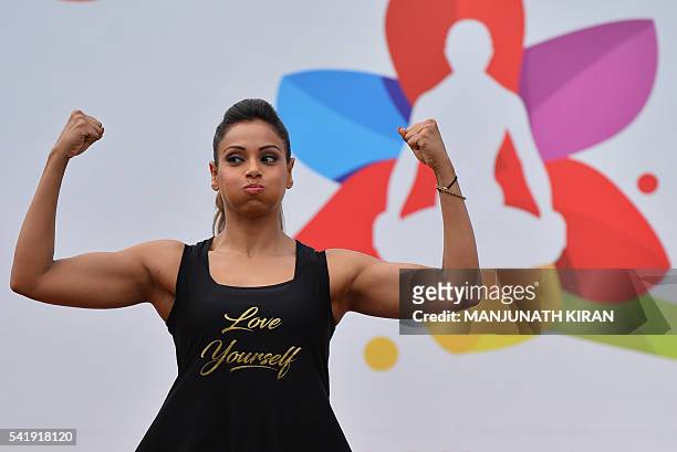 Bollywood actress Bipasha Basu takes part in a yoga session to mark International Yoga Day in Bangalore on June 21, 2016. / AFP / Manjunath Kiran
