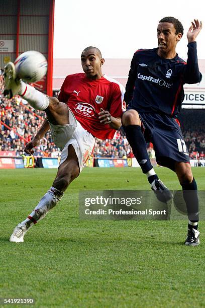 Kevin Betsy of Bristol City gets in a cross ahead of James Perch of Nottingham Forest during a Coca-Cola Football League One match between Bristol...