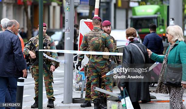 Belgian security forces take security measures as stores were closed due to a phone call reporting a bomb threat at a shopping center area in...