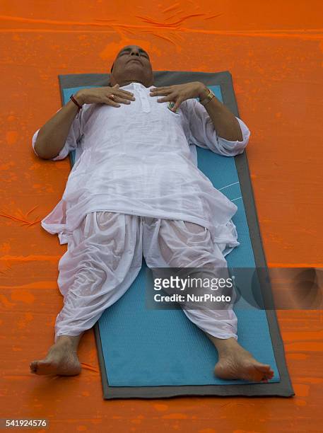 Indian Home Minister mr. Rajnath Singh participates in a mass yoga session , to mark International Yoga Day,during heavy rains at K. D. Singh Babu...