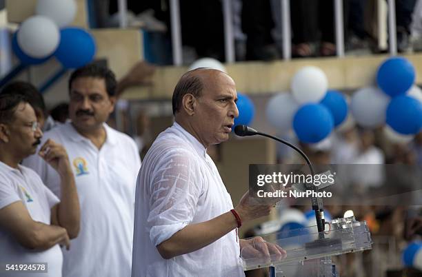 Indian Home Minister mr. Rajnath Singh speaks as he participates in a mass yoga session , to mark International Yoga Day,during heavy rains at K. D....