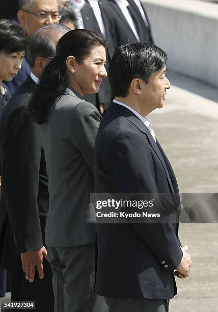 Japan's Crown Prince Naruhito and Crown Princess Masako visit a coastal levee in the northeastern Japan city of Miyako, devastated by the 2011...