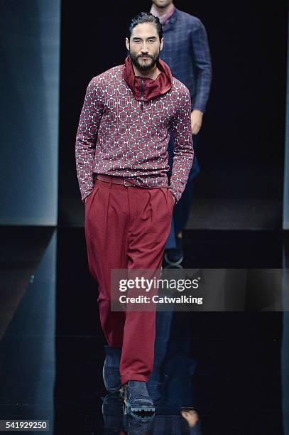 Model Tony Thornburg walks the runway at the Giorgio Armani Spring Summer 2017 fashion show during Milan Menswear Fashion Week on June 21, 2016 in...