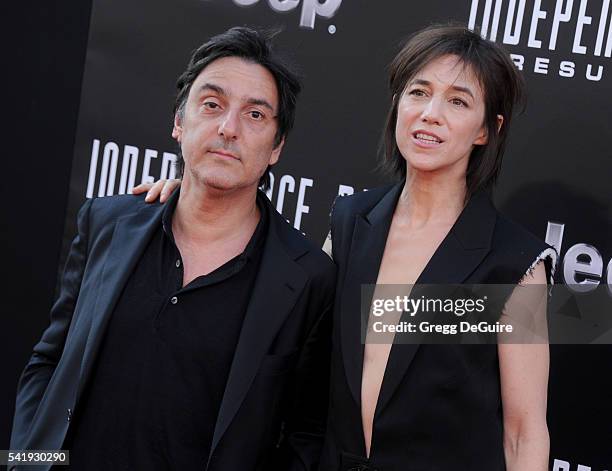 Actress/singer Charlotte Gainsbourg and actor Yvan Attal arrive at the premiere of 20th Century Fox's "Independence Day: Resurgence" at TCL Chinese...