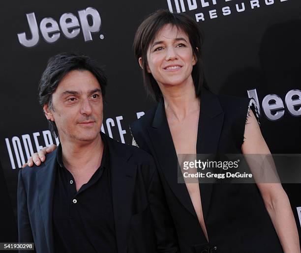 Actress/singer Charlotte Gainsbourg and actor Yvan Attal arrive at the premiere of 20th Century Fox's "Independence Day: Resurgence" at TCL Chinese...