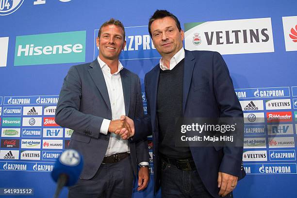 Markus Weinzierl , the newly appointed head coach of FC Schalke 04 and Schalke's manager Christian Heidel pose prior a press conference at Veltins...