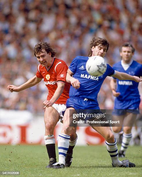 Manchester United captain Bryan Robson clashes with Paul Bracewell of Everton during the FA Cup Final between Manchester United and Everton at...