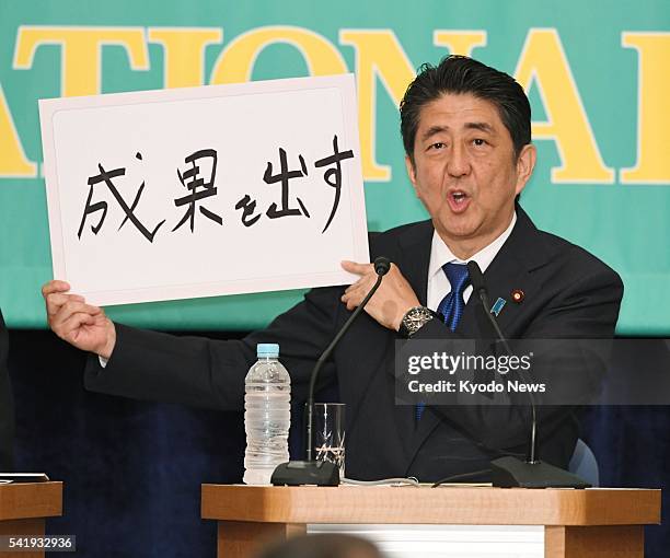 Japanese Prime Minister and Liberal Democratic Party chief Shinzo Abe attends a party leaders' debate at the National Press Club in Tokyo on June 21...