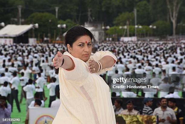 Union HRD minister Smriti Irani performs yoga at Lal Parade Ground on Tuesday to mark the International Yoga Day on June 21, 2016 in Bhopal, India....