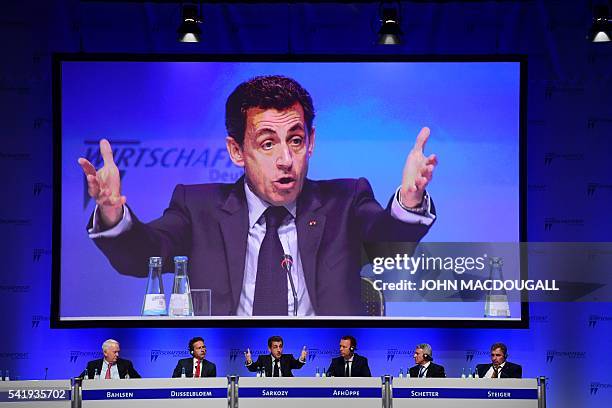 Former French president Nicolas Sarkozy speaks during the conference of the CDU Economic Council Germany next to President of the Werner Michael...