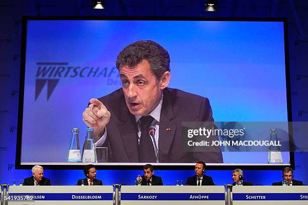 Former French president Nicolas Sarkozy speaks during the conference of the CDU Economic Council Germany next to President of the Werner Michael...