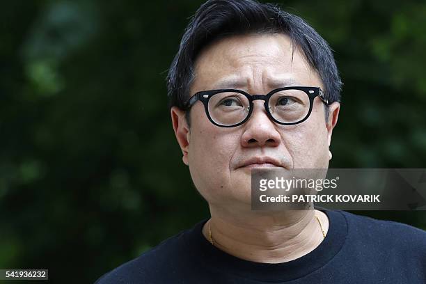 Singapore's director Eric Khoo poses prior to the release of his latest movie 'Hotel Singapura' , on June 21, 2016 in Paris. / AFP / PATRICK KOVARIK