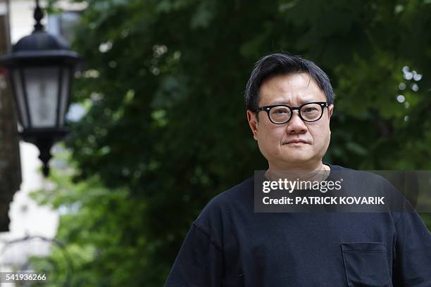 Singapore's director Eric Khoo poses prior to the release of his latest movie 'Hotel Singapura' , on June 21, 2016 in Paris. / AFP / PATRICK KOVARIK