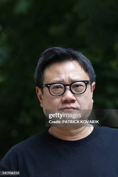 Singapore's director Eric Khoo poses prior to the release of his latest movie 'Hotel Singapura' , on June 21, 2016 in Paris.