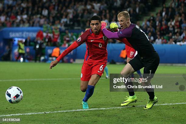 Joe Hart and Chris Smalling of England chase a loose ball during the UEFA Euro 2016 Group B match between Slovakia and England at Stade...