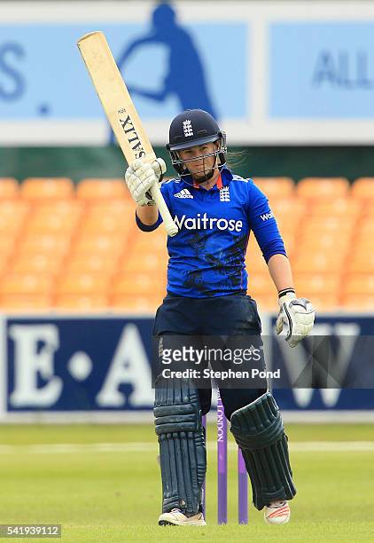 Tamsin Beaumont of England celebrates reaching 50 runs not out during the 1st Royal London ODI match between England Women and Pakistan Women at...