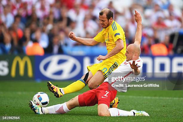 Michal Pazdan of Poland tackles Roman Zozulya of Ukraine during the UEFA EURO 2016 Group C match between Ukraine and Poland at Stade Velodrome on...