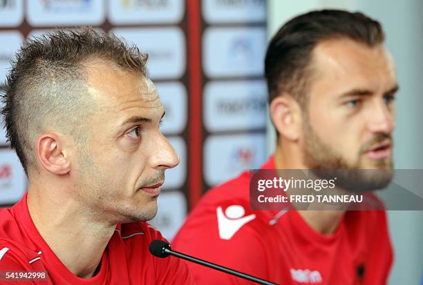 Albania's defender Ansi Agolli and Albania's forward Sokol Cikalleshi hold a press conference at the team's training ground in Perros-Guirec, western...